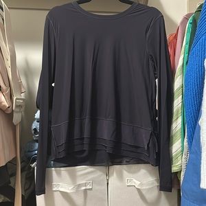 Navy long sleeve lululemon shirt with mesh detail on the bottom